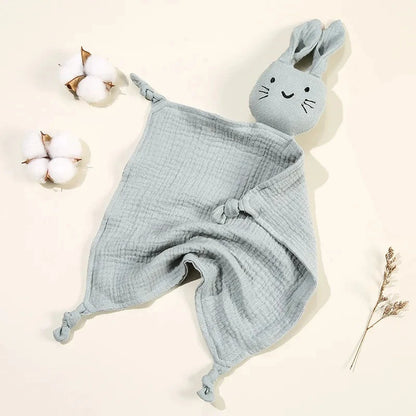 Soothe and pacify a baby girl or boy with this soft cotton muslin comforter blanket in the shape of a cute and cuddly bunny rabbit doll.&nbsp; The cotton and bamboo material preforms excellently as a baby toy, bib and blanket, and makes the perfect newborn gift.