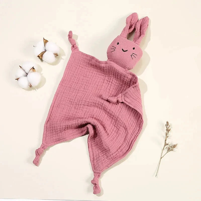 Soothe and pacify a baby girl or boy with this soft cotton muslin comforter blanket in the shape of a cute and cuddly bunny rabbit doll.&nbsp; The cotton and bamboo material preforms excellently as a baby toy, bib and blanket, and makes the perfect newborn gift.