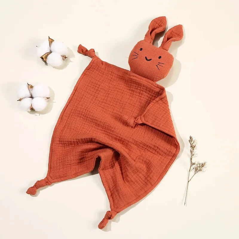 Soothe and pacify a baby girl or boy with this soft cotton muslin comforter blanket in the shape of a cute and cuddly bunny rabbit doll.&nbsp; The cotton and bamboo material preforms excellently as a baby toy, bib and blanket, and makes the perfect newborn gift.