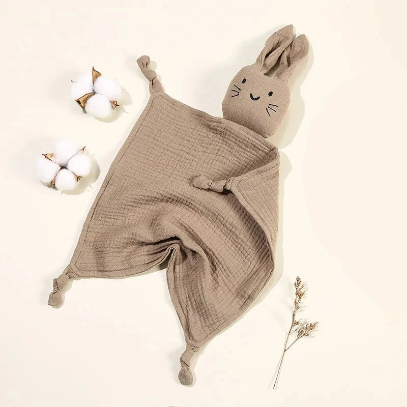 Soothe and pacify a baby girl or boy with this soft cotton muslin comforter blanket in the shape of a cute and cuddly bunny rabbit doll.&nbsp; The cotton and bamboo material preforms excellently as a baby toy, bib and blanket, and makes the perfect newborn gift.