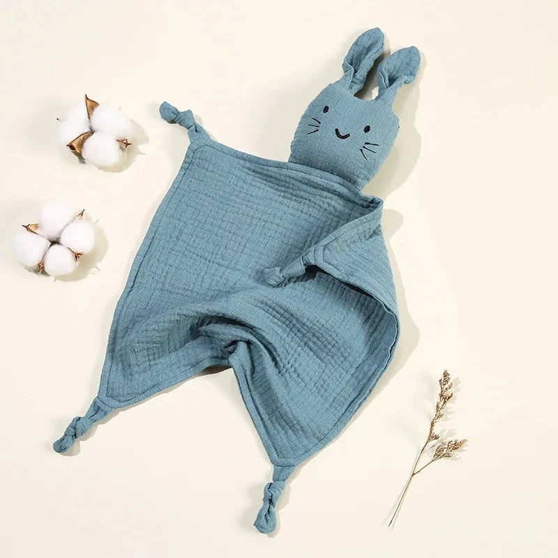 Soothe and pacify a baby girl or boy with this soft cotton muslin comforter blanket in the shape of a cute and cuddly bunny rabbit doll.&nbsp; The cotton and bamboo material preforms excellently as a baby toy, bib and blanket, and makes the perfect newborn gift.