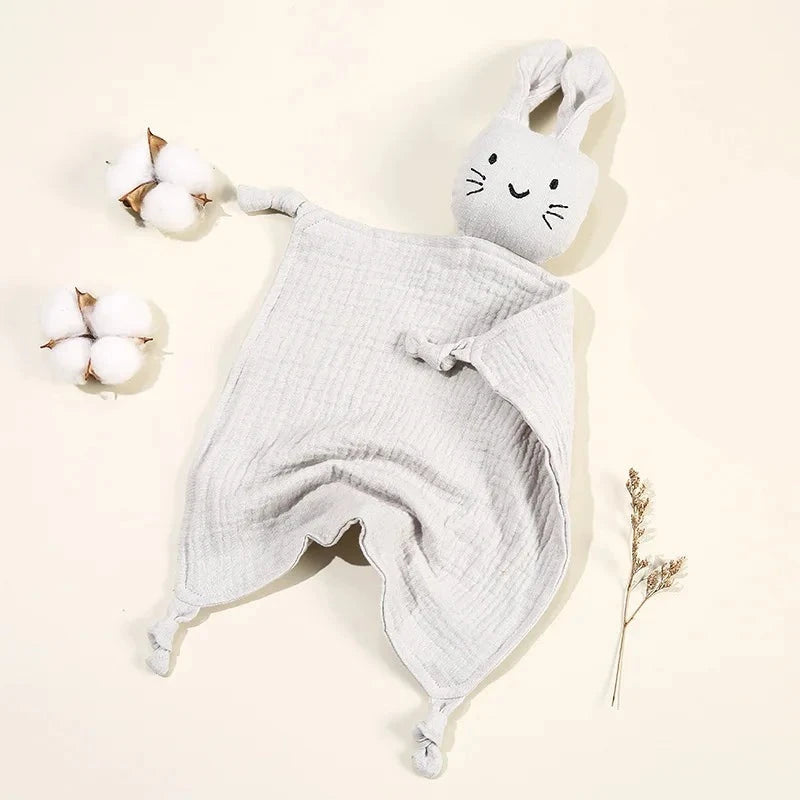 Soothe and pacify a baby girl or boy with this soft cotton muslin comforter blanket in the shape of a cute and cuddly bunny rabbit doll.&nbsp; The cotton and bamboo material preforms excellently as a baby toy, bib and blanket, and makes the perfect newborn gift.