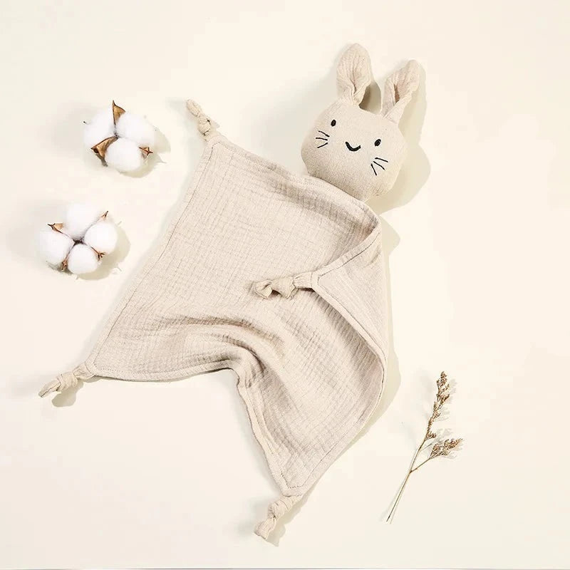 Soothe and pacify a baby girl or boy with this soft cotton muslin comforter blanket in the shape of a cute and cuddly bunny rabbit doll.&nbsp; The cotton and bamboo material preforms excellently as a baby toy, bib and blanket, and makes the perfect newborn gift.